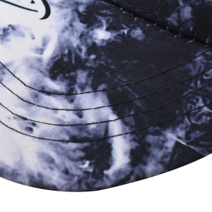 Close-up of baseball cap brim featuring black and white tie-dye graffiti patterns