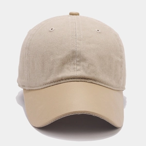 Detail of vintage baseball cap featuring mixed textures of cotton fabric and leather brim