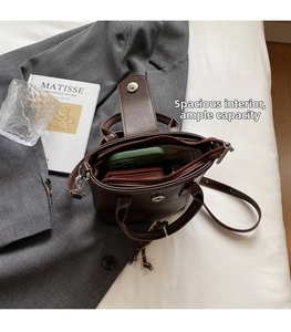 Interior view showing the storage capacity of the brown vintage leather crossbody bucket bag