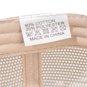 Detail shot of trucker hat interior showing 80% cotton breathable mesh and reinforced seams