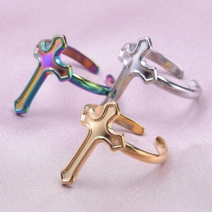 Three-piece adjustable cross rings set in gold, silver, and rainbow stainless steel