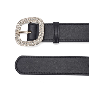 Elegant black faux leather belt featuring a gold square buckle with rhinestone inlay