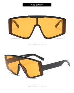Detail view of oversized shield sunglasses with C03 brown frames and orange lenses