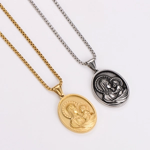 Detailed relief of Mother and Child on gold and silver vintage oval pendant necklaces