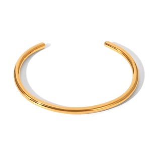 Detail of 18K gold-plated stainless steel open cuff bracelet with polished finish