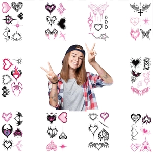 Y2K style pink and black heart temporary tattoos with wings and flame designs for parties