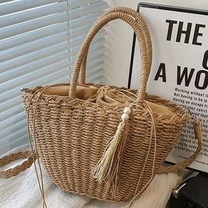 Handmade beige straw tote bag with decorative pearls and tassel fringe detail