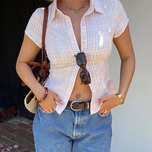 Close-up of women red and white checkered short sleeve shirt with button down front detail