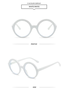 Detail view of white round frame sunglasses with unique embossed texture and sleek finish