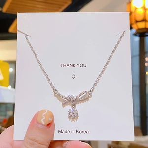 Sparkling bow and snowflake pendant necklace with zircon in silver titanium steel