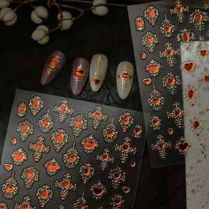Macro detail of Baroque heart gemstone nail decals with gold frames and 3D resin accents
