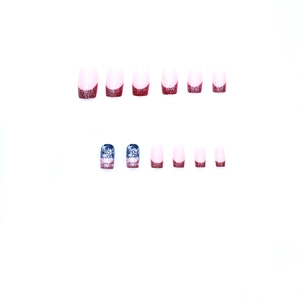 Short square press-on nails with red glitter and patriotic star and stripe designs