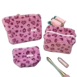 Pink plush leopard heart print cosmetic bag set with three sizes for travel storage