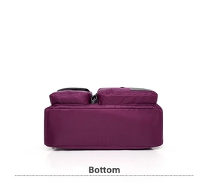 Detailed bottom view of large purple nylon handbag showing thick waterproof fabric