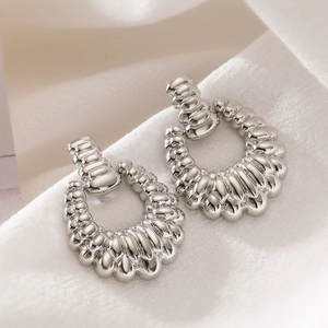 Minimalist silver metal irregular spiral wave earrings with high-gloss mirror finish