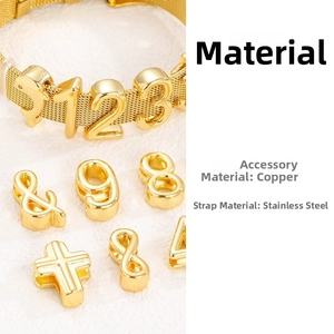 Macro detail of 10mm golden stainless steel mesh bracelet with copper charm inserts