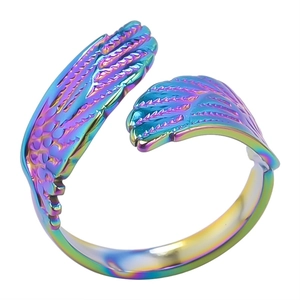 Detailed view of rainbow-colored angel wing ring with adjustable open band design