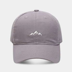 Close-up of mountain embroidery and stitched brim on cotton outdoor baseball cap
