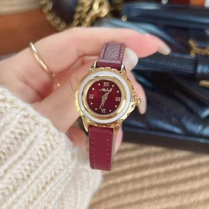 Retro women's quartz watch with gold case, red dial, Roman numerals and red leather strap