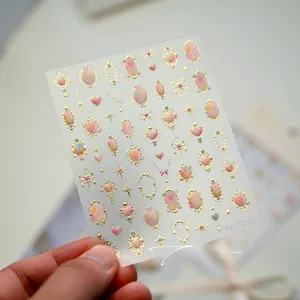 Detailed view of M-1211 nail art stickers with golden gemstone and relief designs