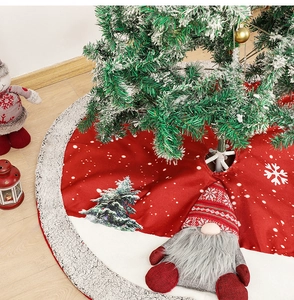 Detail of red burlap Christmas tree skirt with plush white border and festive gnome pattern