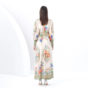 Vintage floral maxi dress with stand collar and lantern sleeves shown from the back view