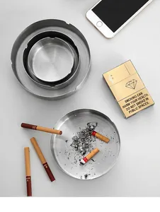 Detailed top view of a 4-piece set of silver stainless steel ashtrays in varied sizes