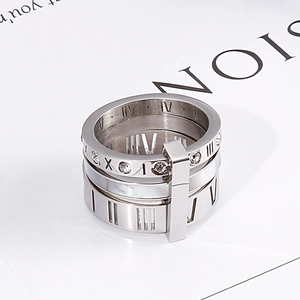 Detailed close-up of silver titanium steel ring with sparkling crystals and Roman numerals