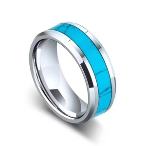 Detailed macro view of a men's titanium steel ring featuring a vibrant turquoise inlay.