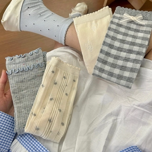Blue Japanese style crew socks with bows and floral patterns in a variety pack