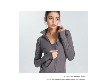 Detailed view of the thumb hole cuffs on a slim-fit grey yoga jacket for running