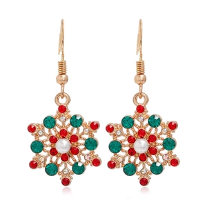 Close-up of snowflake Christmas earrings with gold alloy base and red green rhinestones