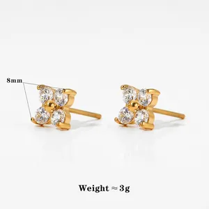 Detailed view of 8mm flower stud earrings featuring gold plating and clear cubic zirconia