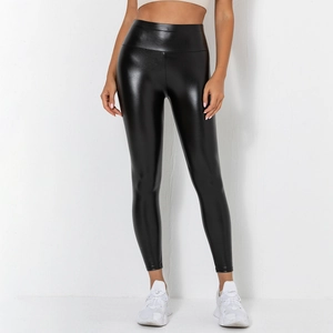 Detail view of high-waist shiny black PU leather leggings with a glossy stretch finish