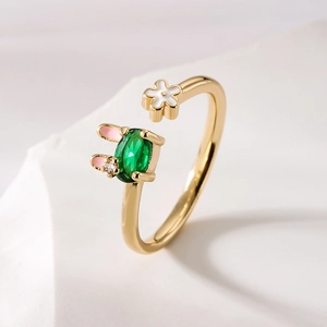 18K gold plated adjustable ring with a green gemstone rabbit and white flower detail