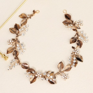 Vintage bridal headband featuring golden alloy leaves and crystal flower vine details