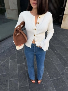 Vintage white flare sleeve knit cardigan with gold buttons and high-waist jeans