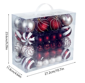 Transparent storage box showing assorted red, white, and silver Christmas ornaments with sizes
