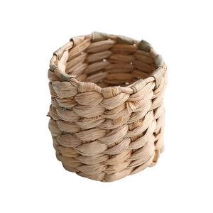 Handcrafted cylindrical beige natural seagrass woven napkin ring for rustic dining decor