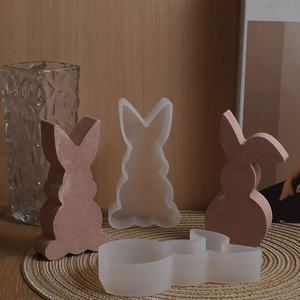 Detailed views of 3D bunny silicone molds and finished rabbit aromatherapy candles