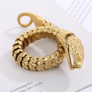 Macro shot of gold snake scale texture on a vintage titanium steel bracelet link