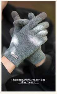 Close-up of thick knitted winter gloves with touch screen fingertips and branded label