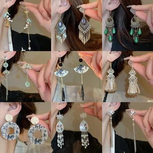Chinese style earring collection featuring pearl tassels and bamboo flower designs