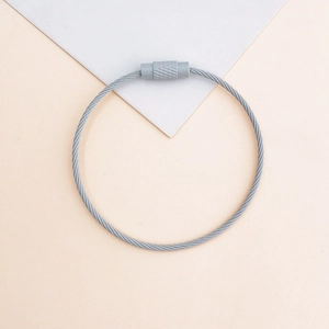 Detailed close-up of a grey coated metal wire keychain with a secure screw fastener