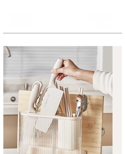 Detail of cream-style kitchen knife holder with partitioned cutlery organizer and drain base