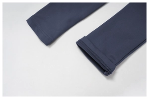 Detail of high-density thermal fabric with double-needle stitching on navy yoga jumpsuit