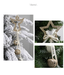 Detail of Christmas tree star and angel ornaments with glitter finish and bells