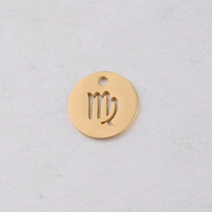 Macro detail of 12mm gold mirror steel round pendant with hollow Virgo constellation sign