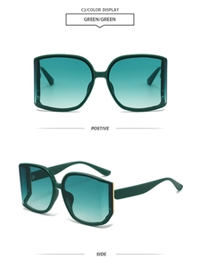 Vista detallada de gafas de sol verdes con lentes degradadas y bisagras doradas