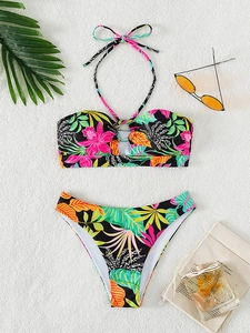 Detailed flat lay of tropical floral print bikini with halter neck and ring detail